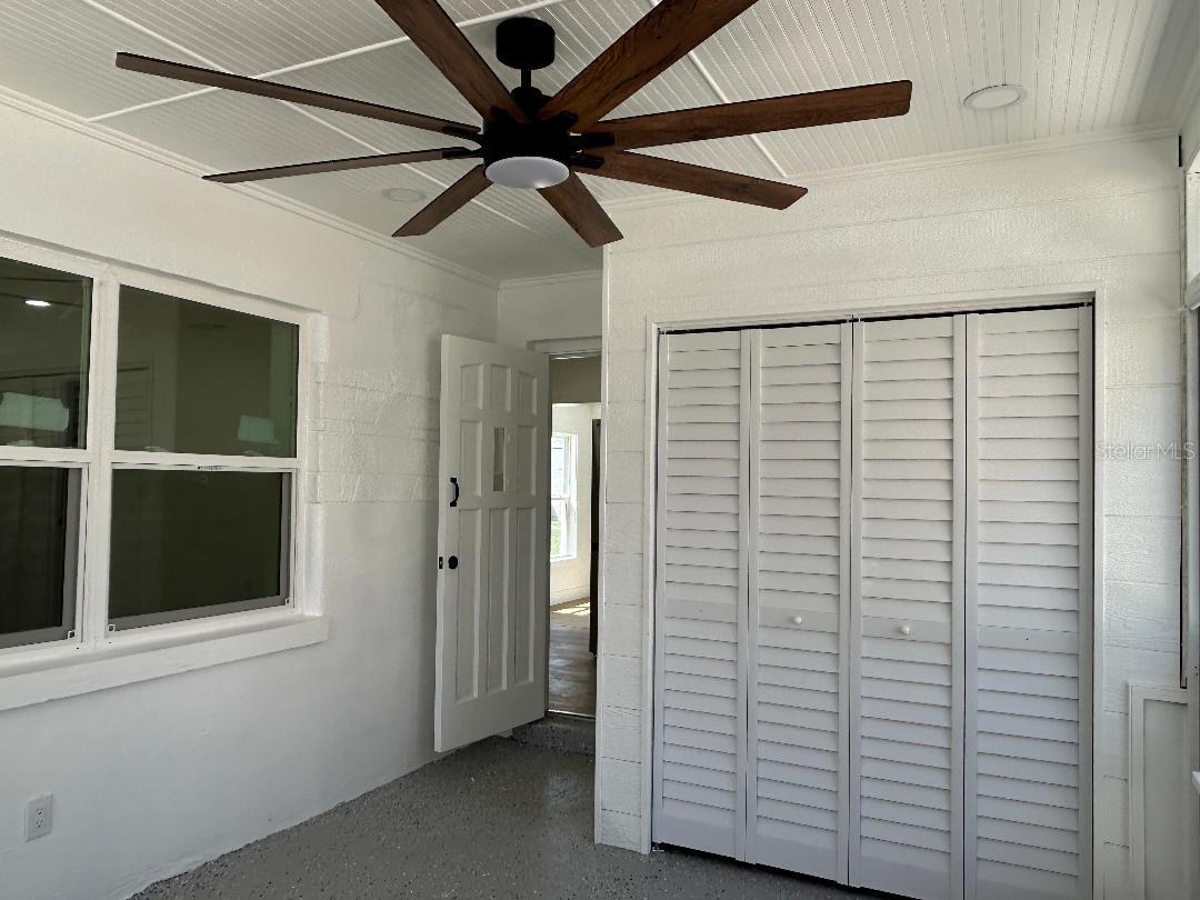 Beadboard ceiling, large fanprovides coolness for sitting area