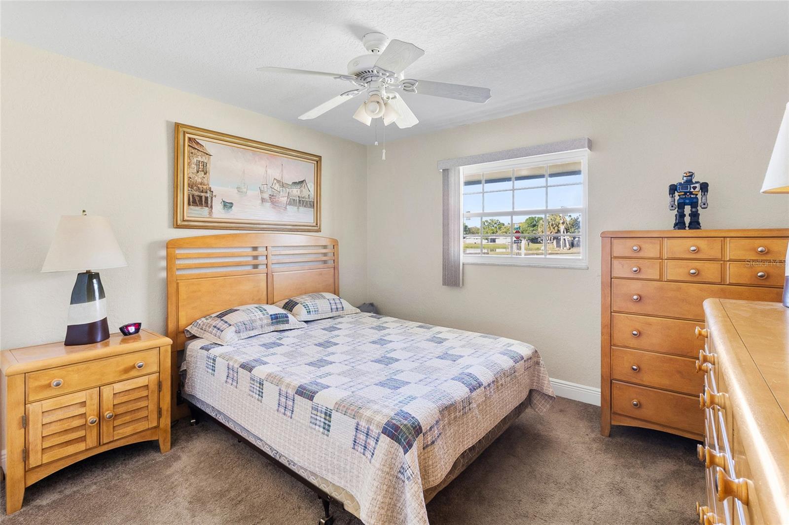 Bedroom # 2 with carpet flooring and ceiling fan