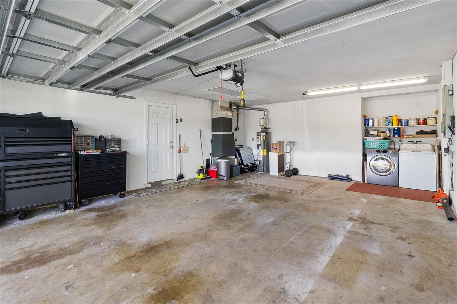 Oversize 2-car garage with door opener ands lots of storage space