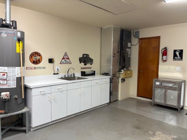 garage/water heater, sink and cabinets
