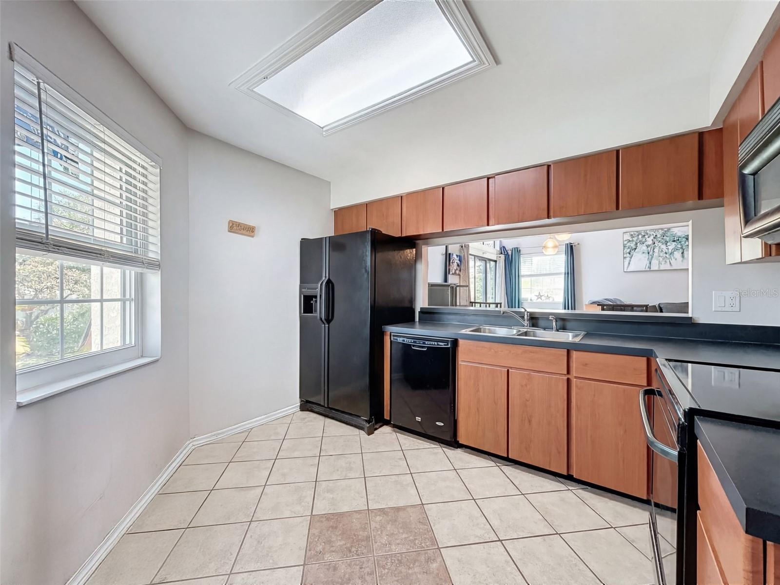 The kitchen is thoughtfully designed with ample cabinetry and workspace, making meal prep effortless and enjoyable.