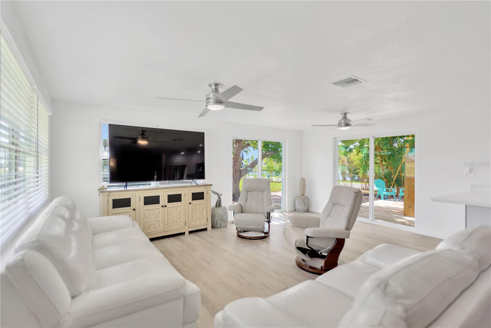 Relax and enjoy in this welcoming Living space with outdoor views from every window/door.