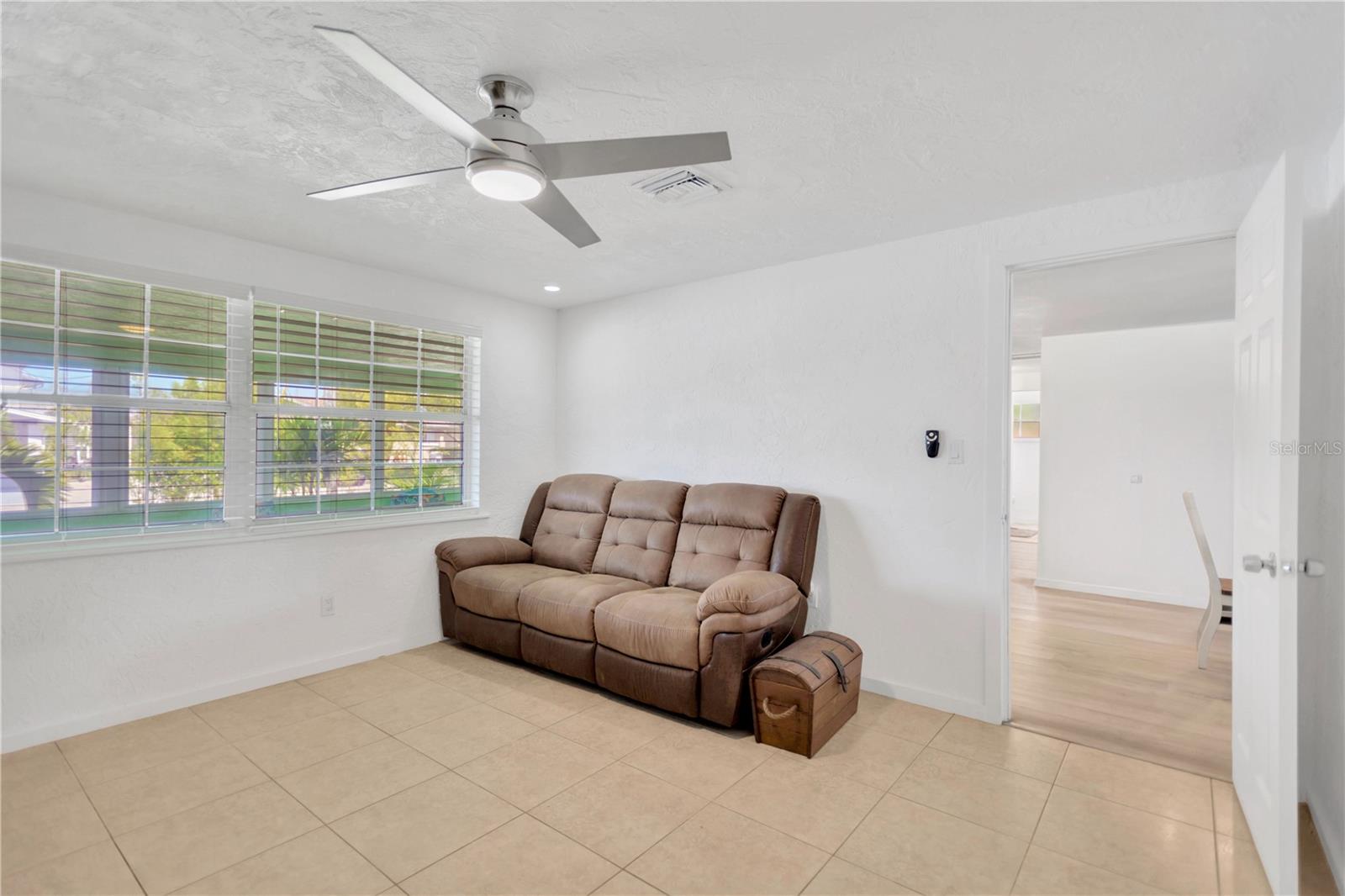 Another view of Bonus Room with full wall of windows for sparkling natural light.