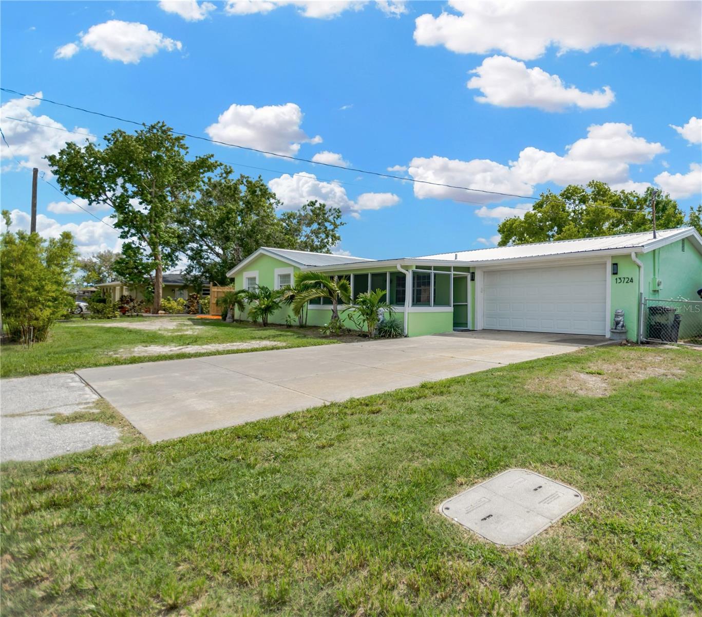 This property offers both side yard space to park your boat or store your RV complete with electric & plumbing onsite.