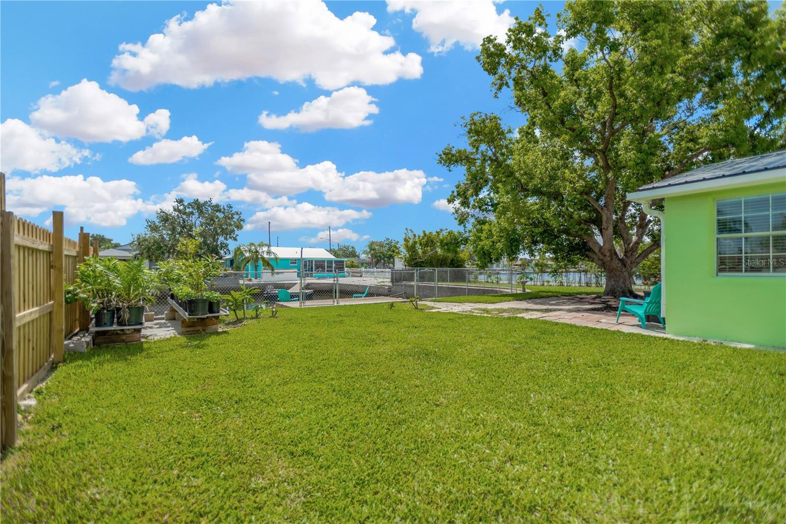 Side yard provides ample green space to enjoy a garden or store your water toys.  Property is fully fenced.