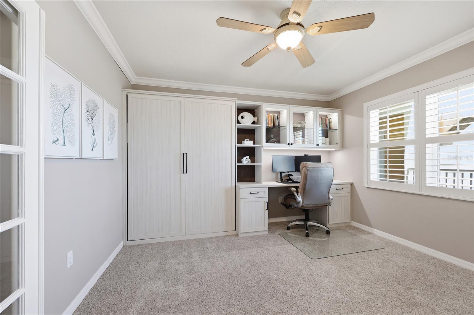 Third bedroom has custom murphy bed & work space
