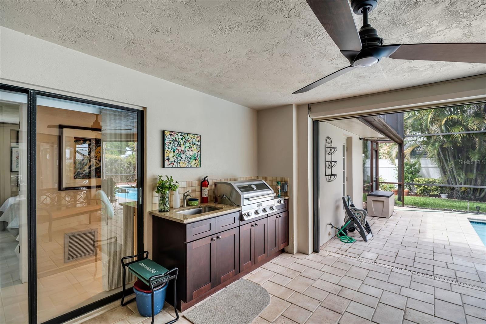 Covered and caged outdoor kitchen-fully equipped