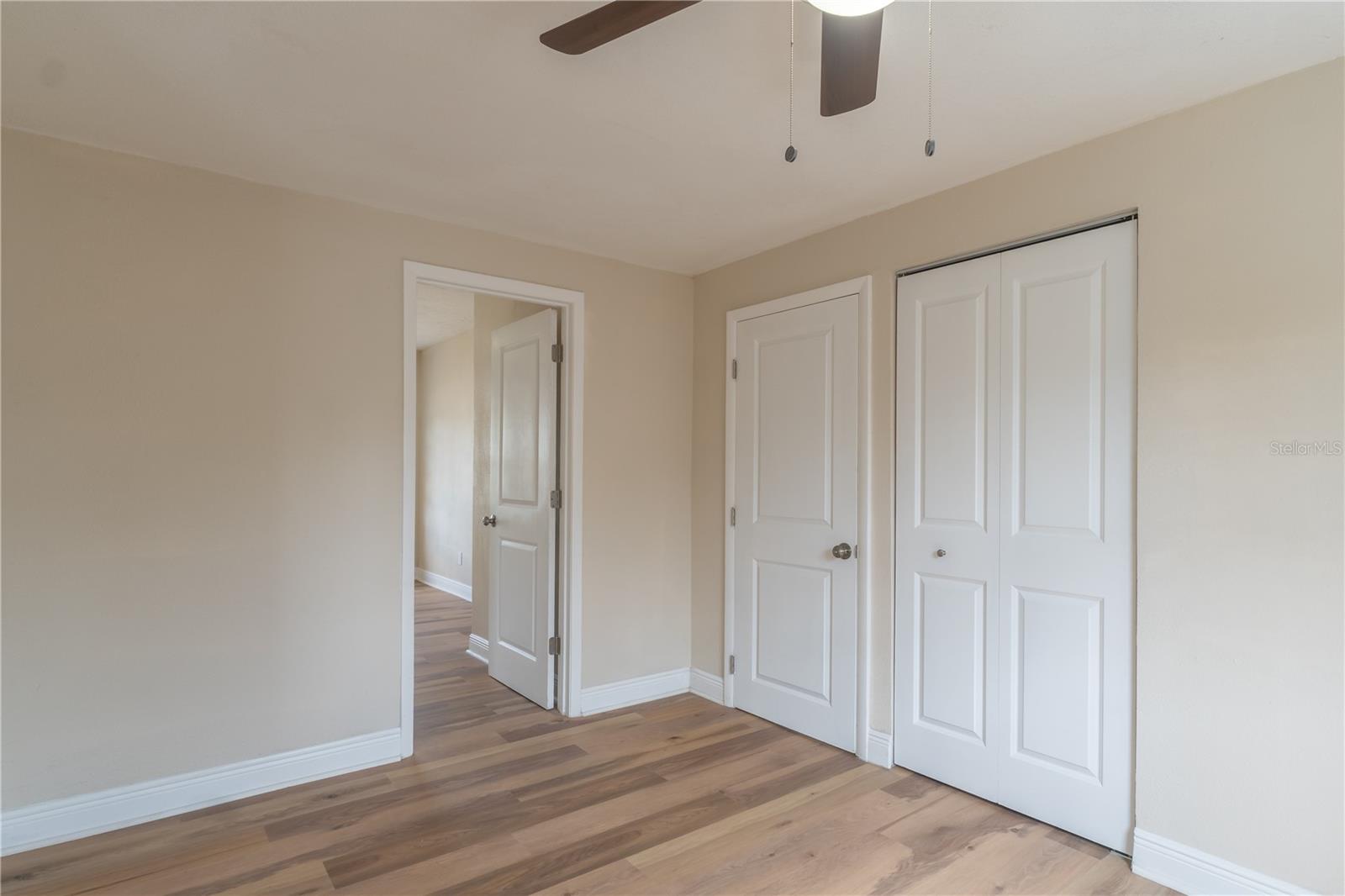 Standing in dining room peaking into bedroom #4. Closet to right is the laundry closet.