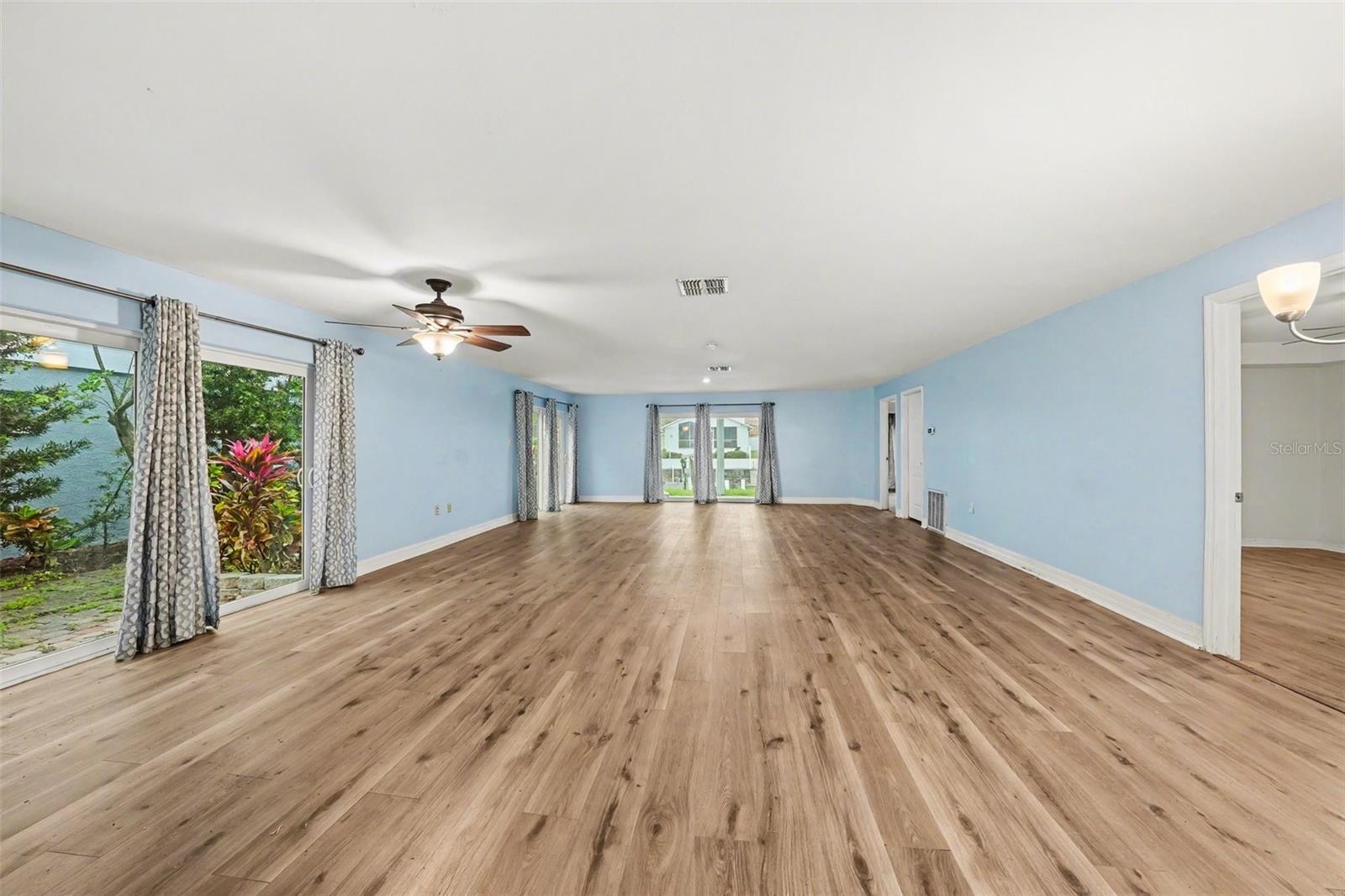 Huge rec room on lower level with newer hurricane windows and sliders.