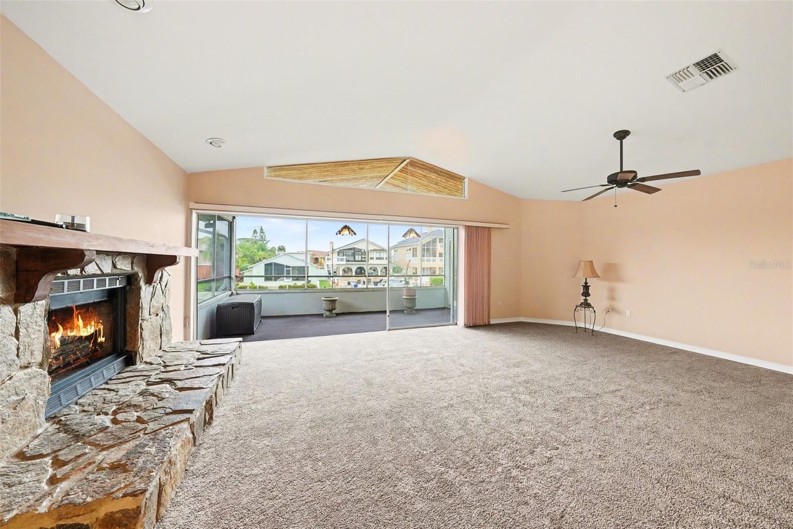 Huge sliders opening up to the screened in patio overlooking the canal.