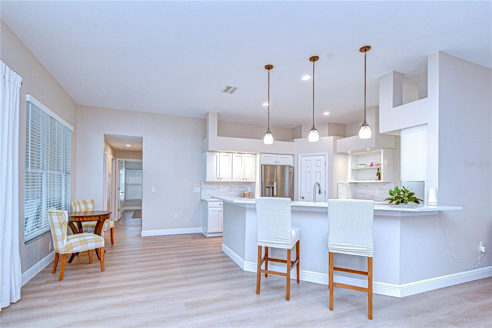 Spacious dining area with abundant sunlight.