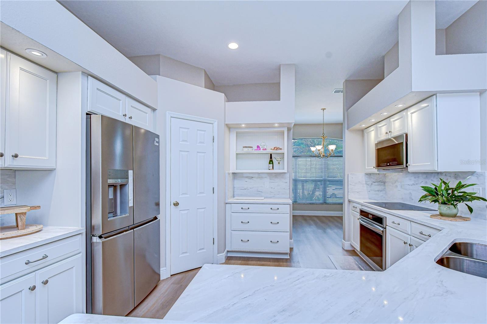 Crisp white cabinetry offering ample storage.