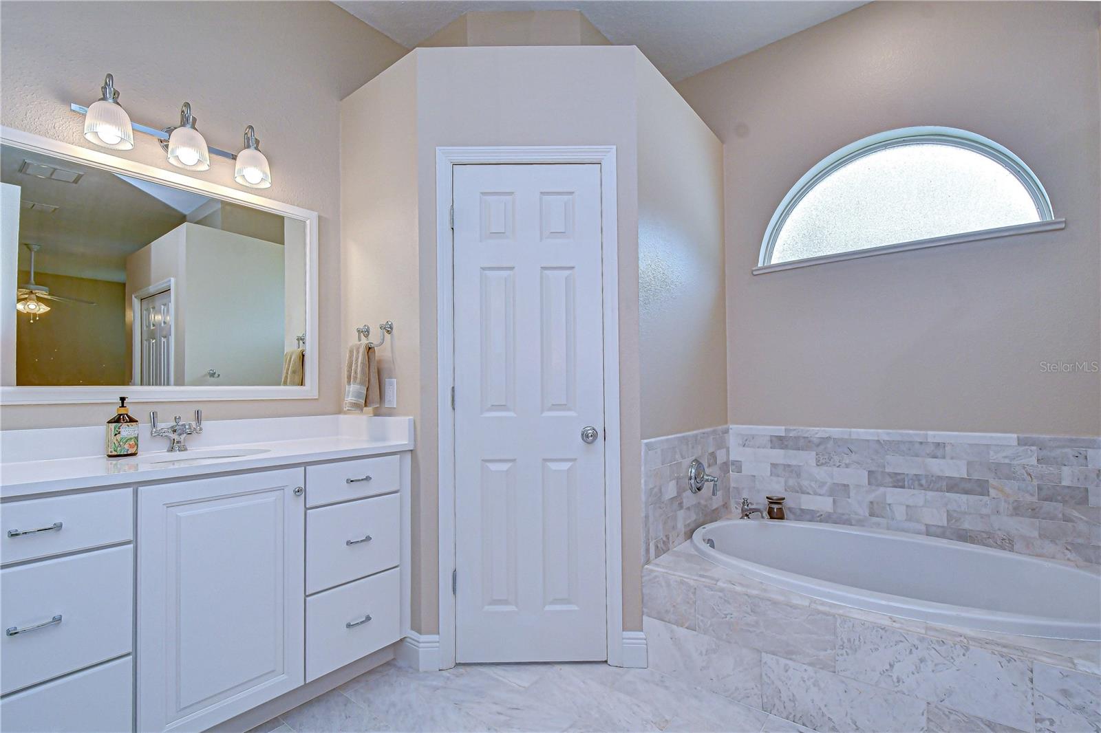 Separate soaking tub and walk-in shower.