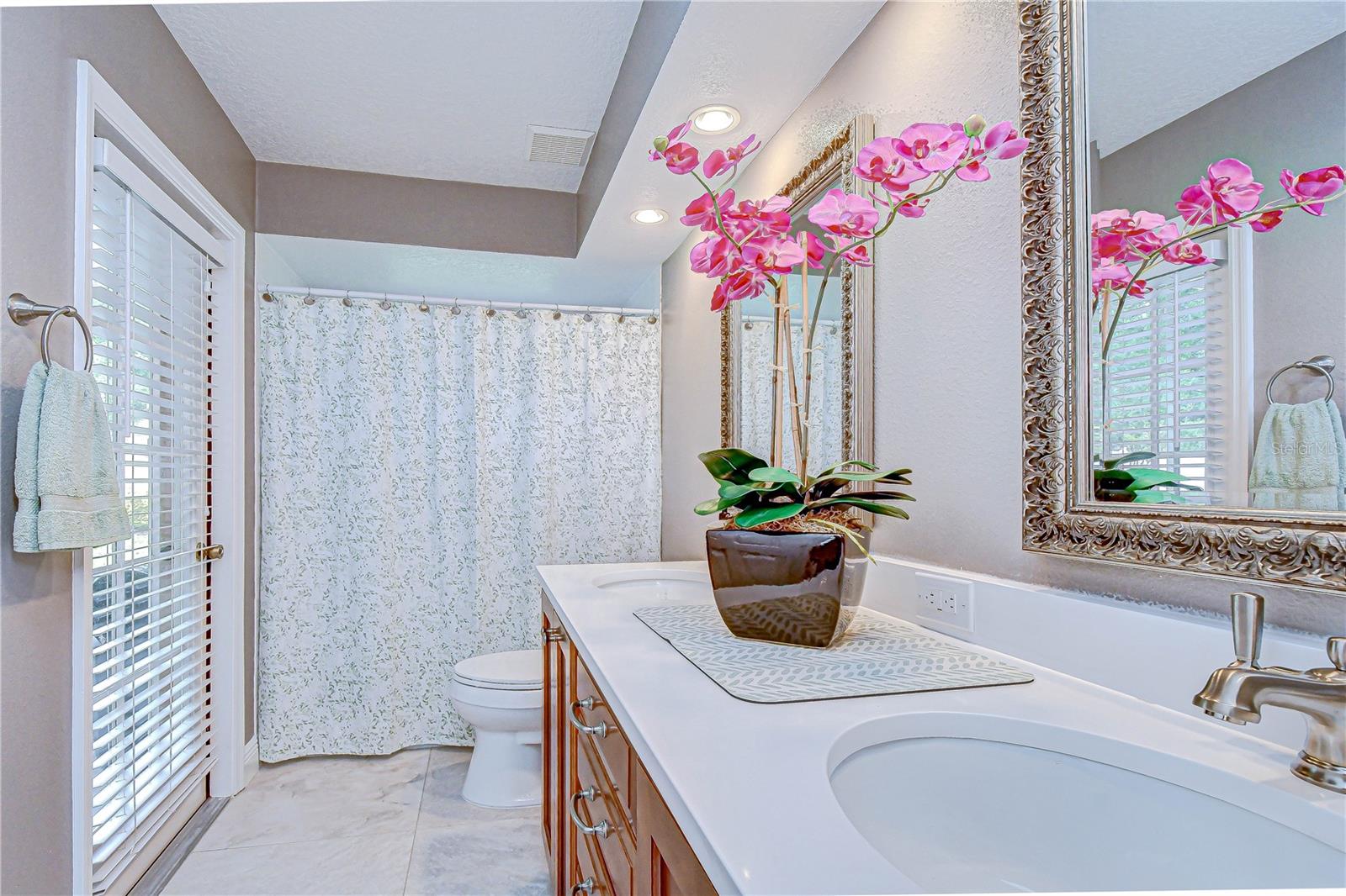 Full bathroom shared by secondary bedrooms.