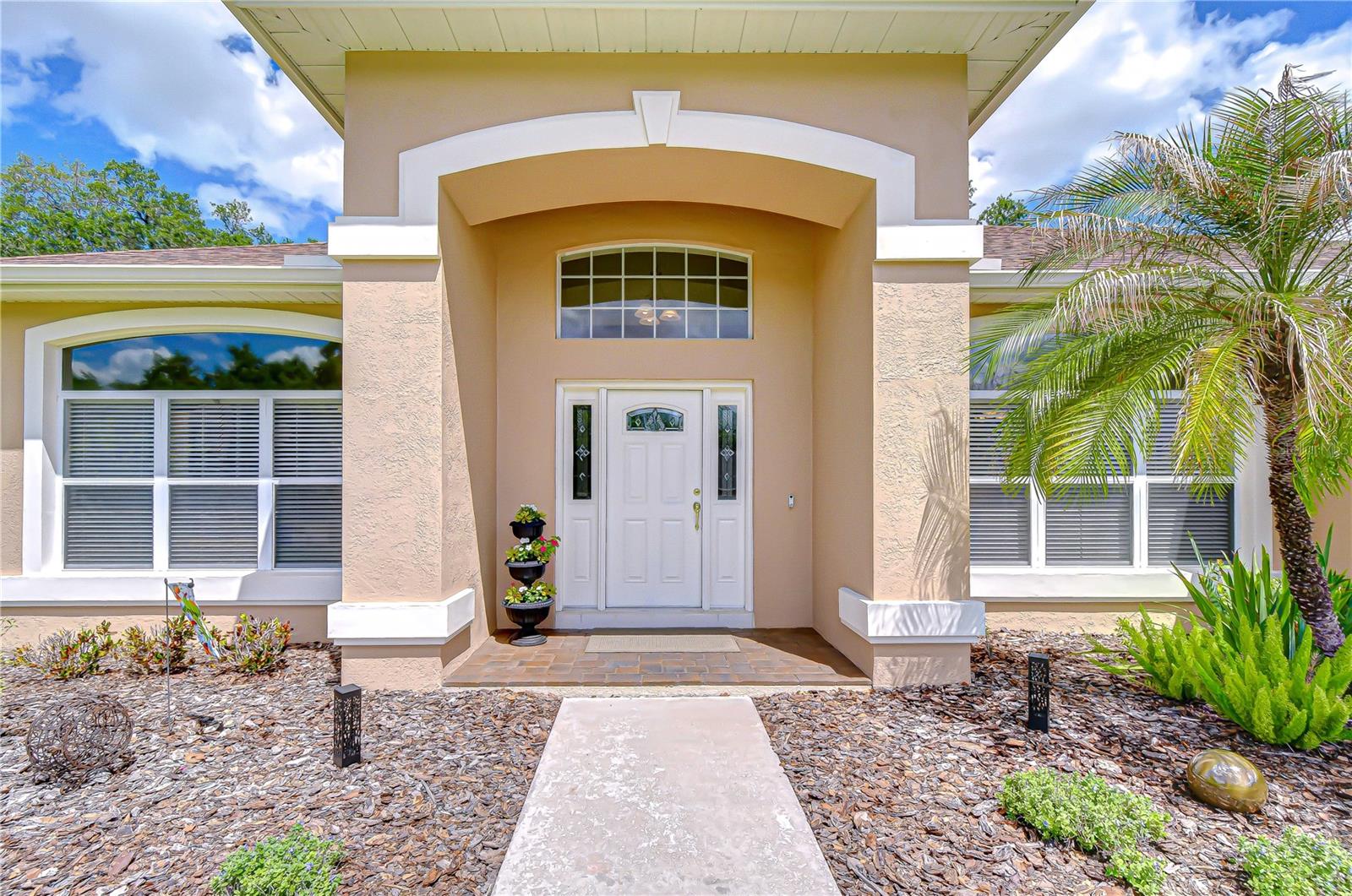 Charming curb appeal with updated exterior features.