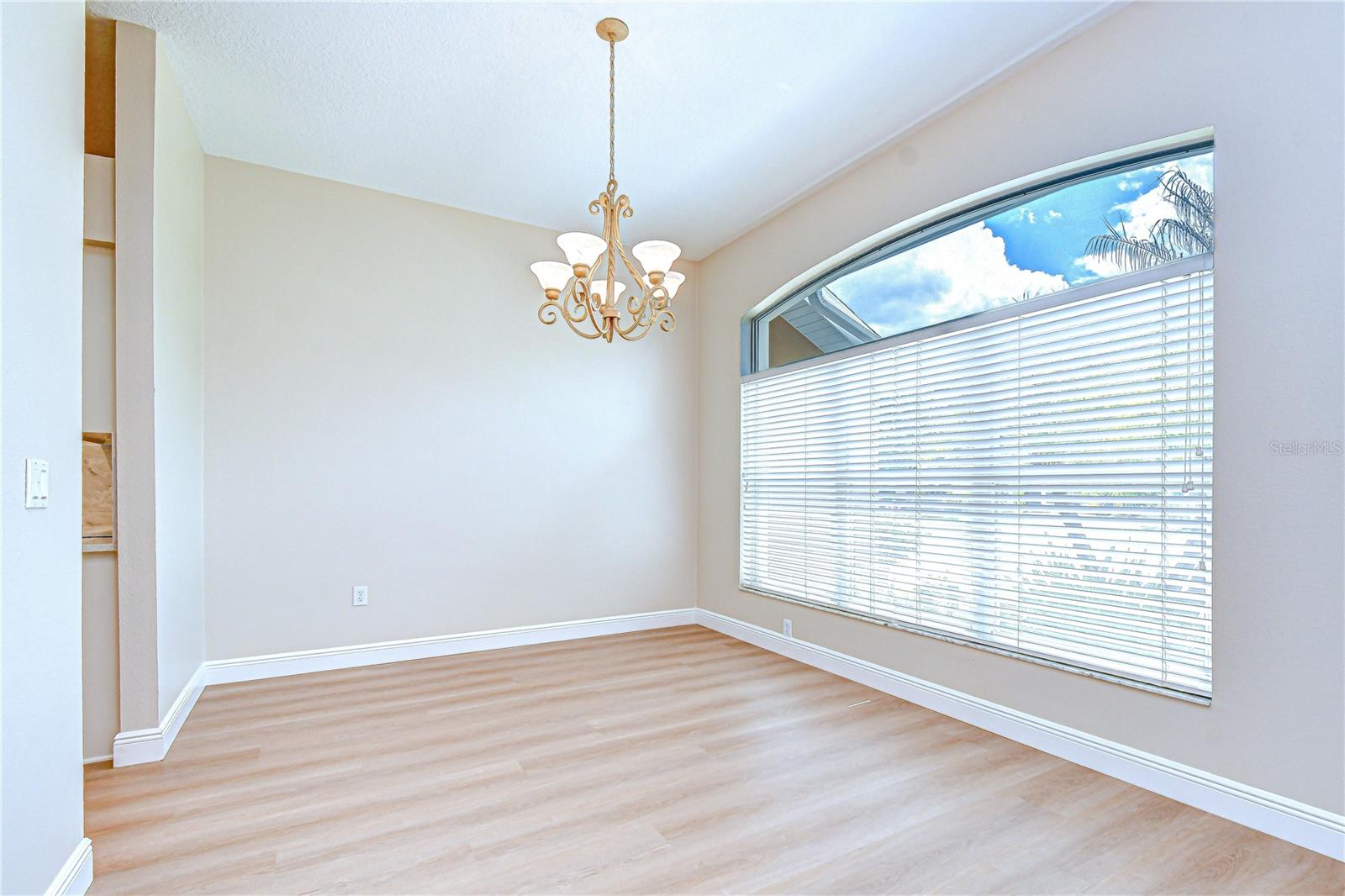 Spacious dining area with abundant sunlight.