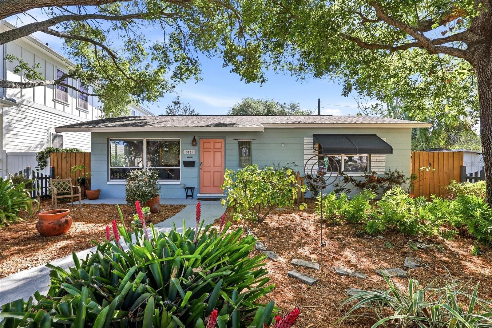 Front exterior with mature landscaping and inviting entryway
