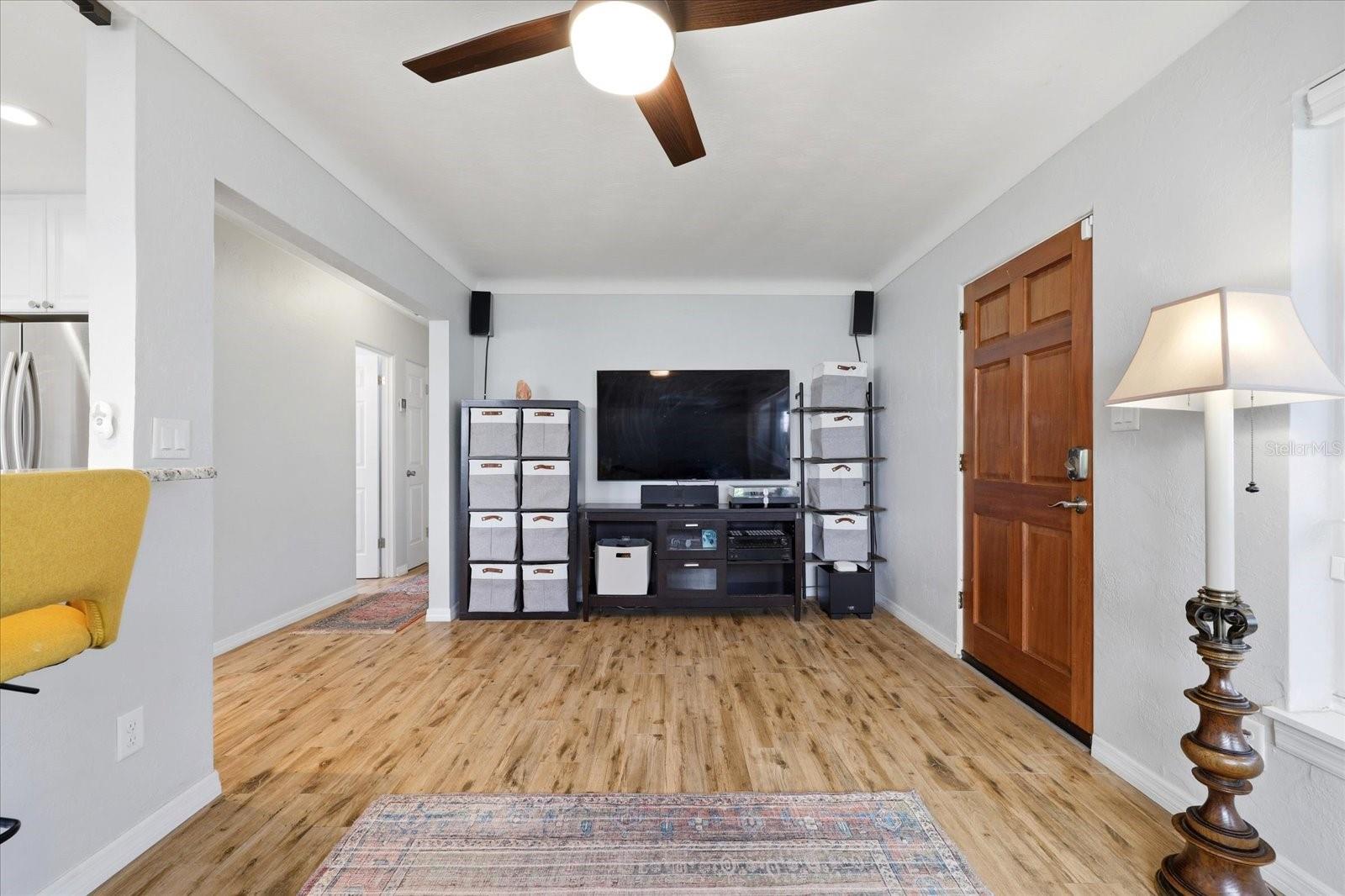 Spacious living room with open layout and media wall