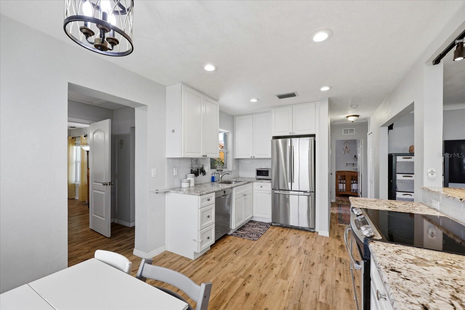 Kitchen view toward living space showcasing open concept design