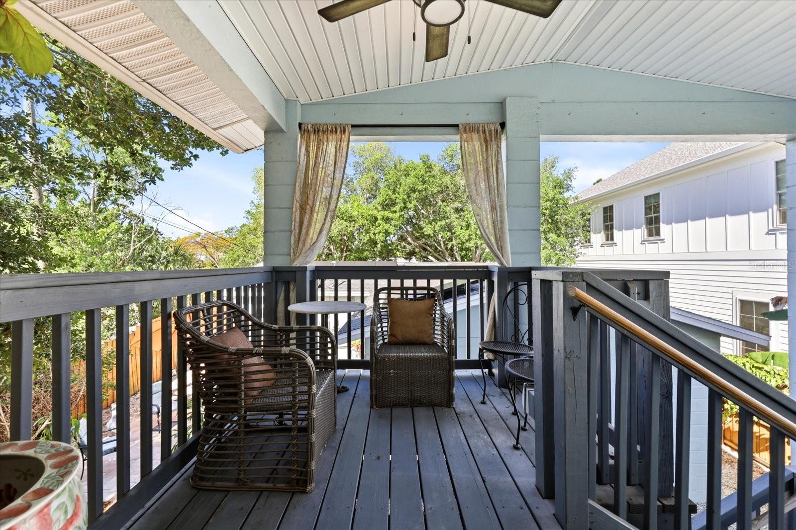 Private upper-level deck with covered seating area