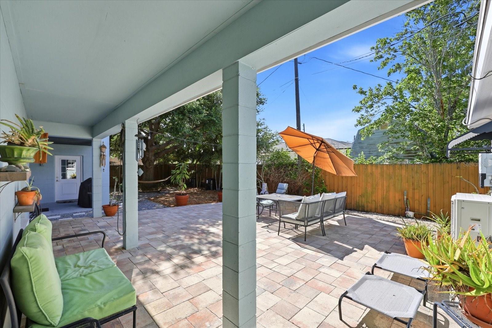 Partially covered patio and paver courtyard ideal for outdoor entertaining