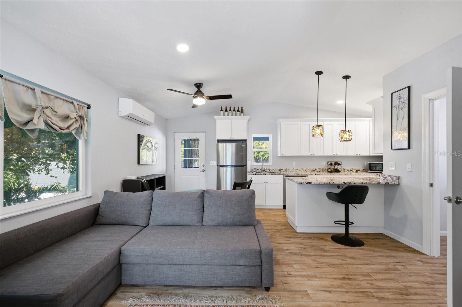 Open-concept ADU living and kitchen area with natural light