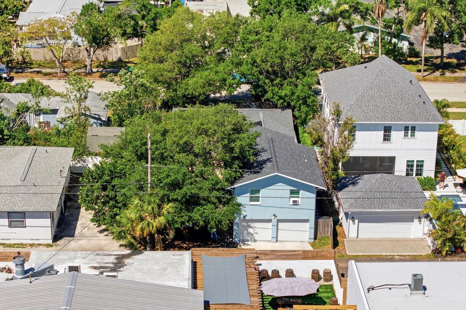 Aerial view of property highlighting ADU, garage, and surrounding neighborhood