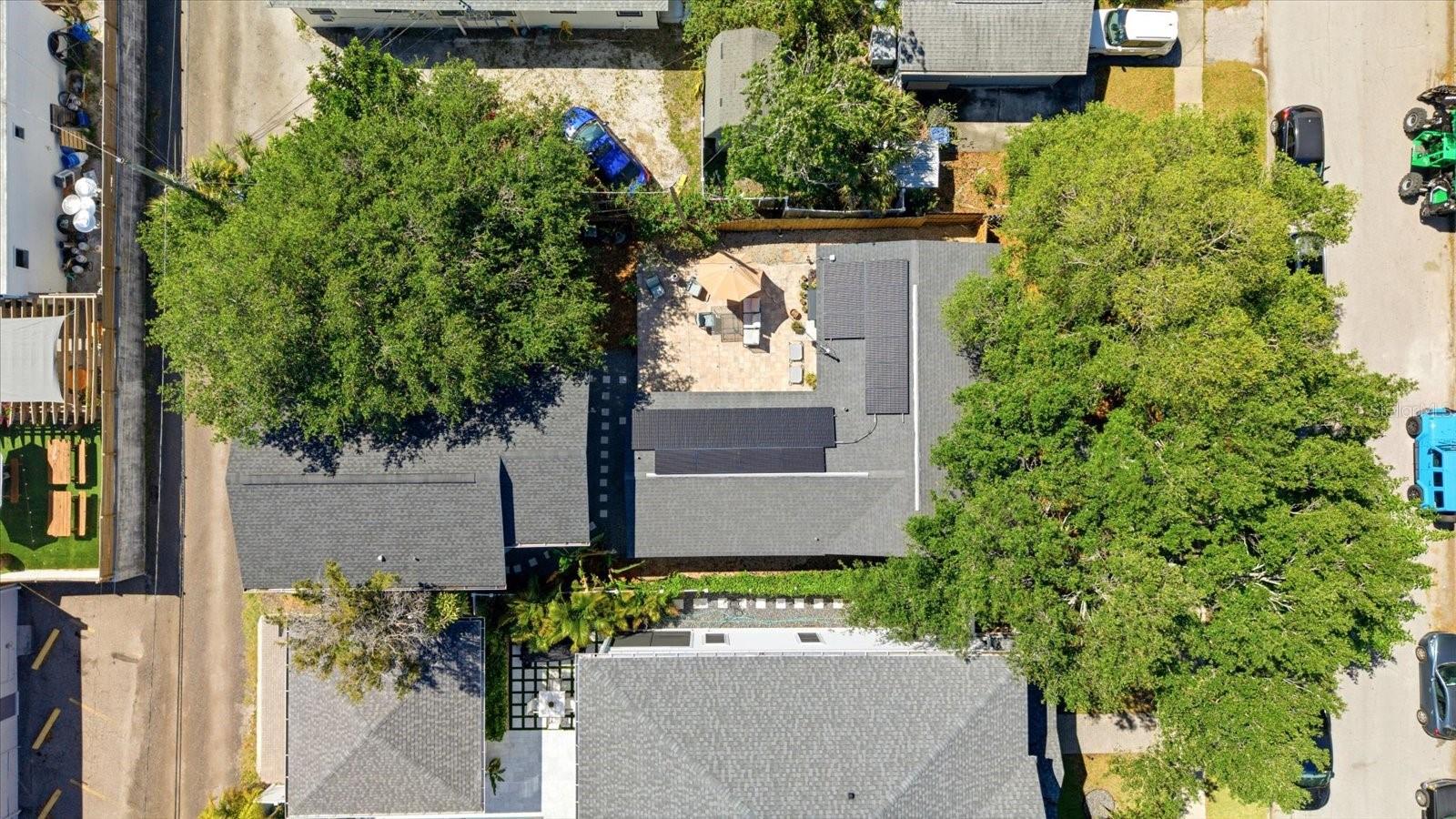 Overhead view showcasing solar panel system and backyard layout