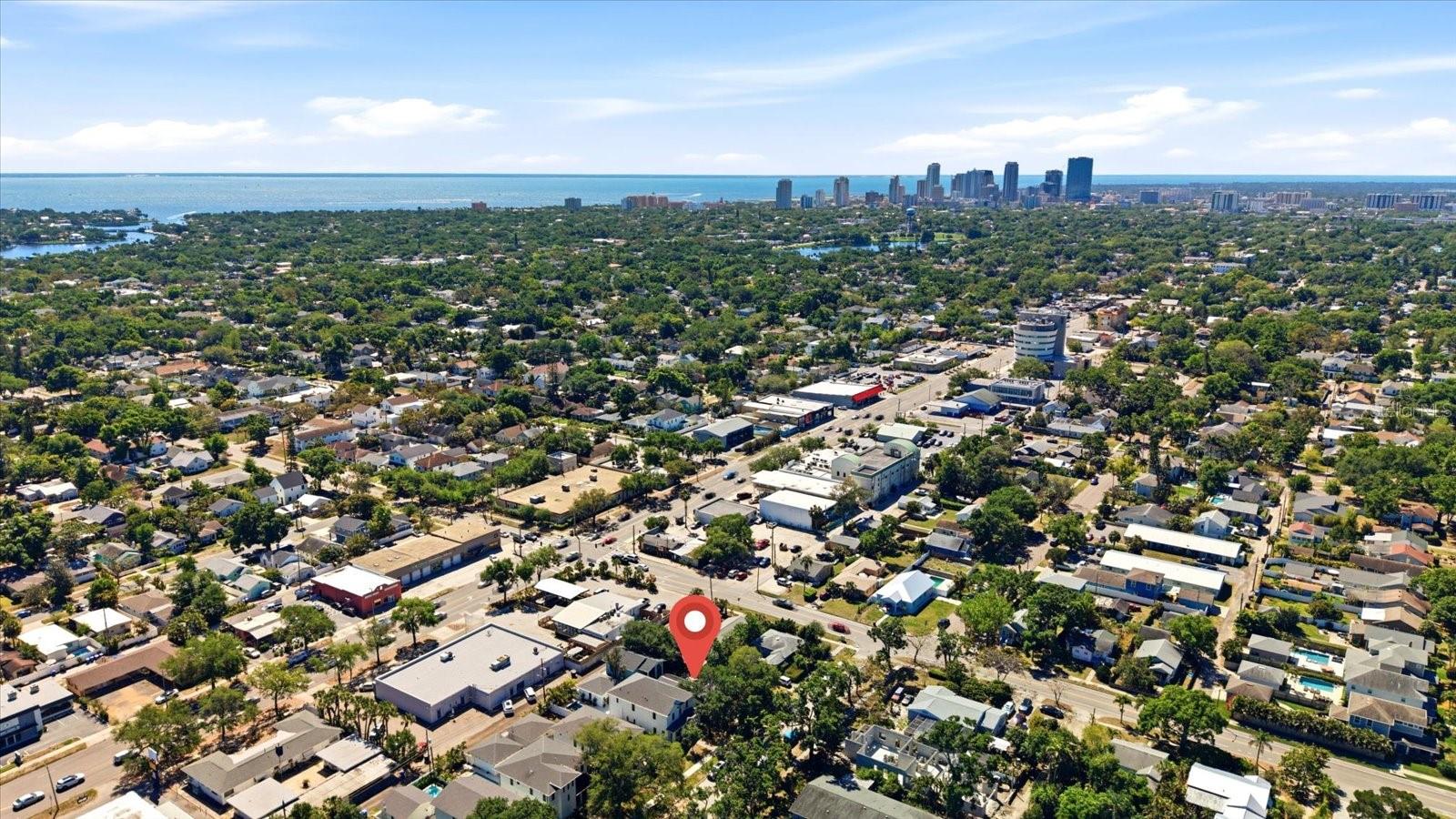 Aerial view featuring downtown St. Petersburg skyline and surrounding area