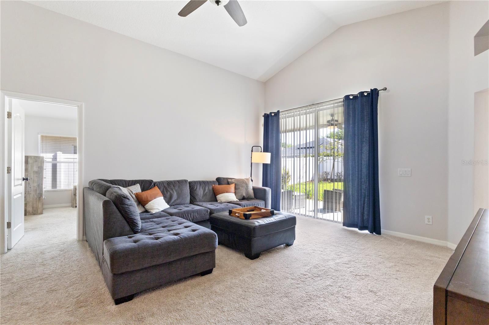 The light and bright living area offers a blank pallet for your future taste in decor!