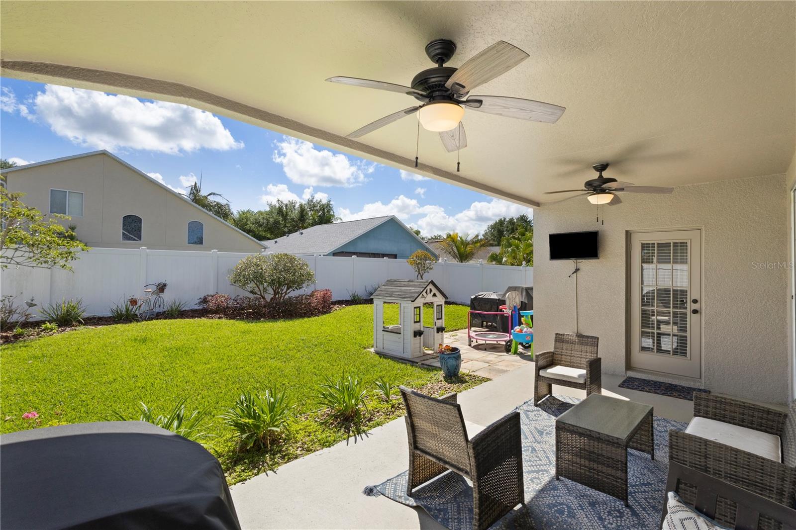 The spacious covered patio overlooks the private fully fenced backyard!