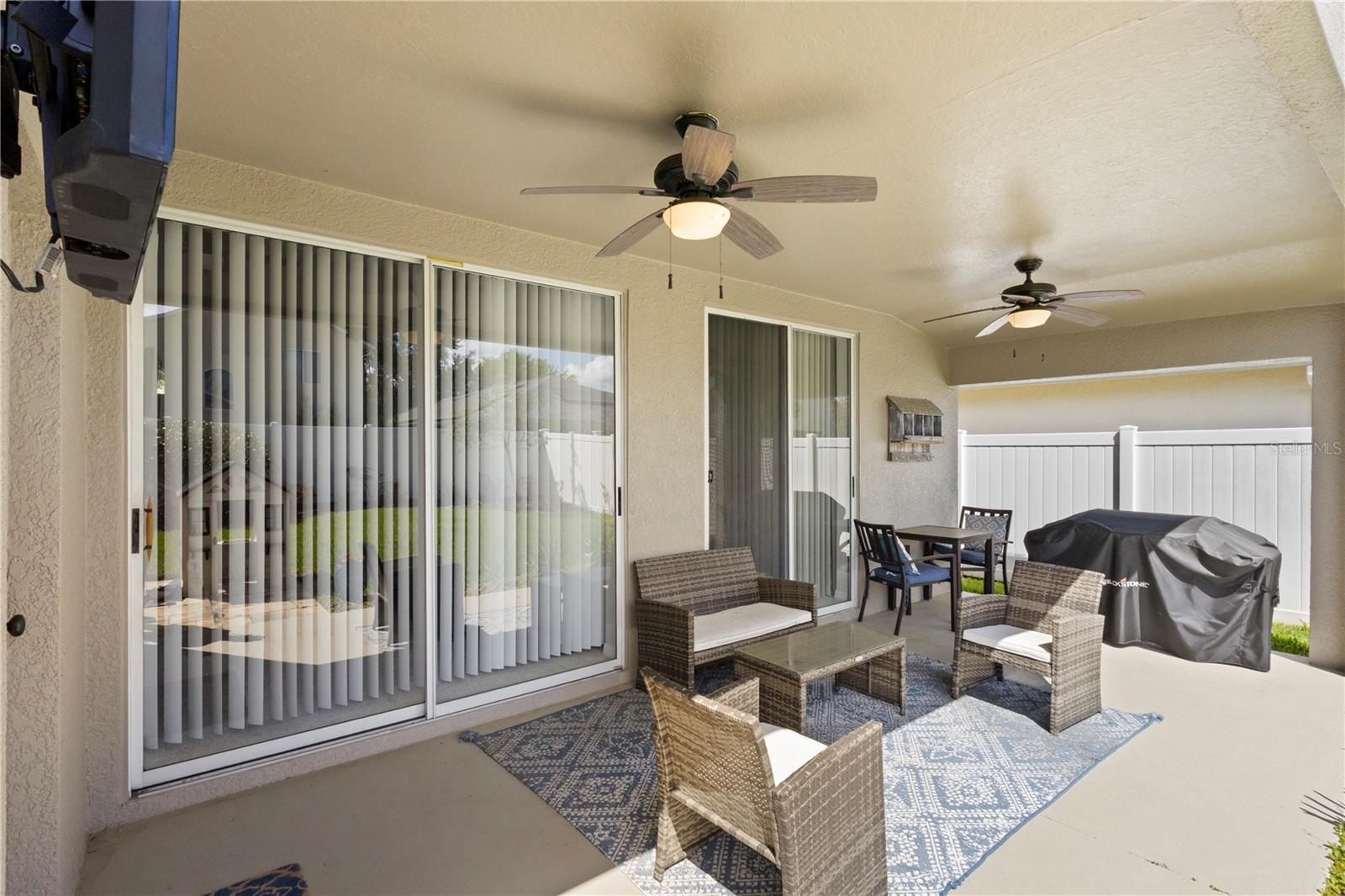 Sliding glass doors lead to either the family room or the primary bedroom from your large covered lanai.