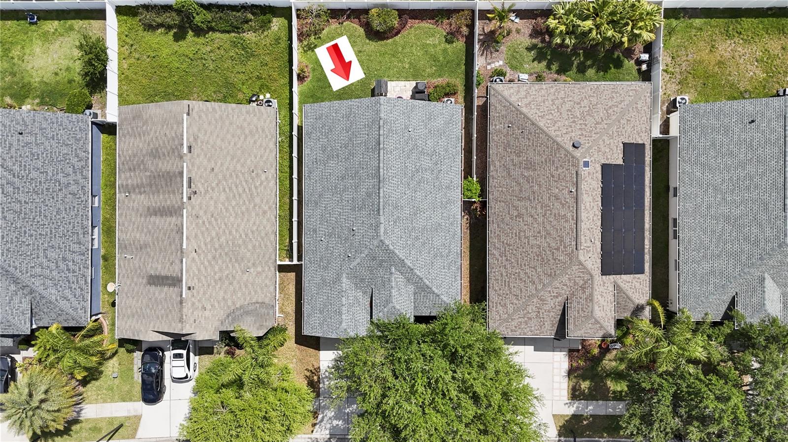 An aerial view of neatly maintained homes in a quiet community.