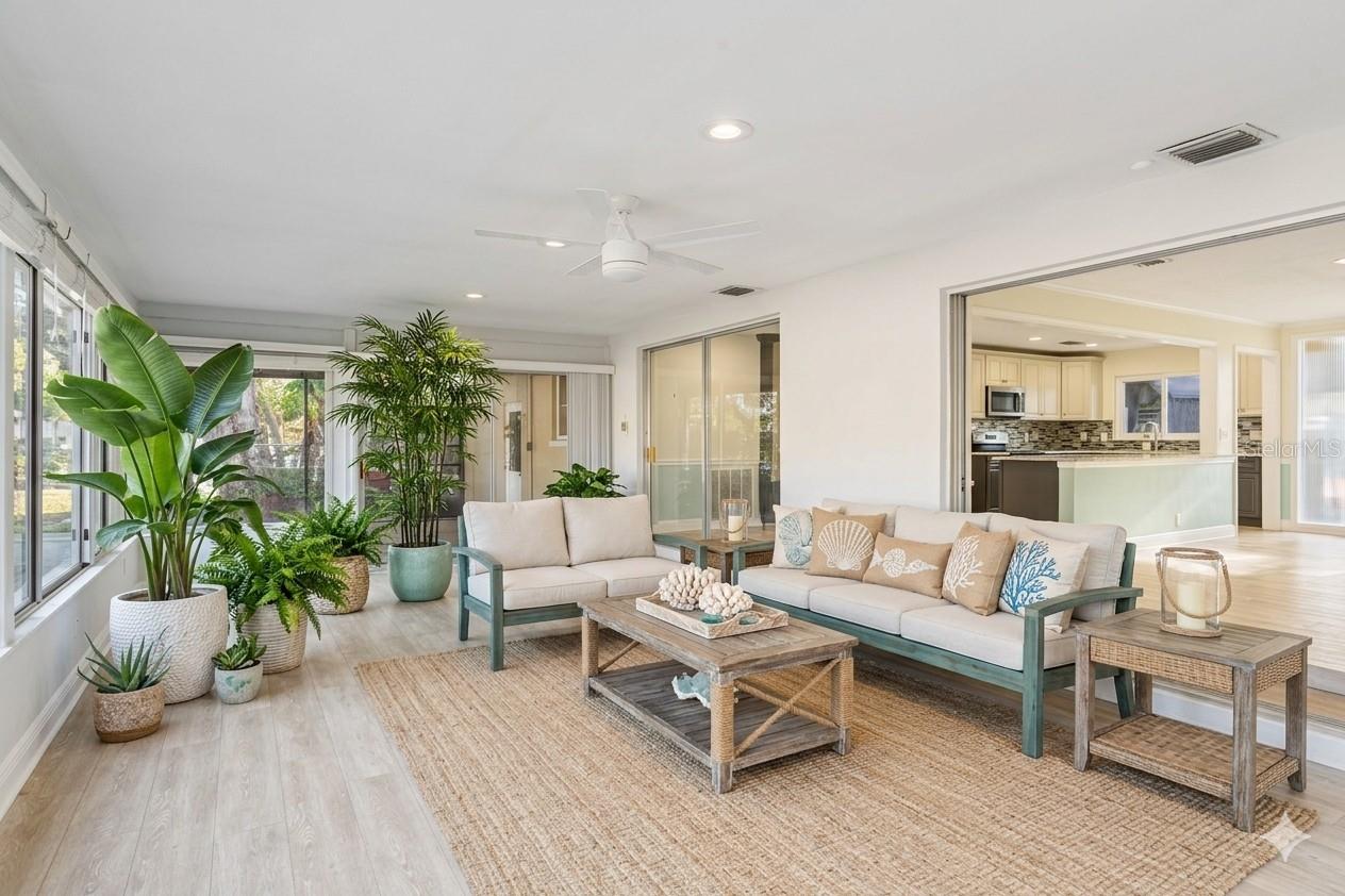 AI enhanced photo Huge year-around lanai.  Use it as a separate living area, homework space, or a space to relax and sip your morning coffee.