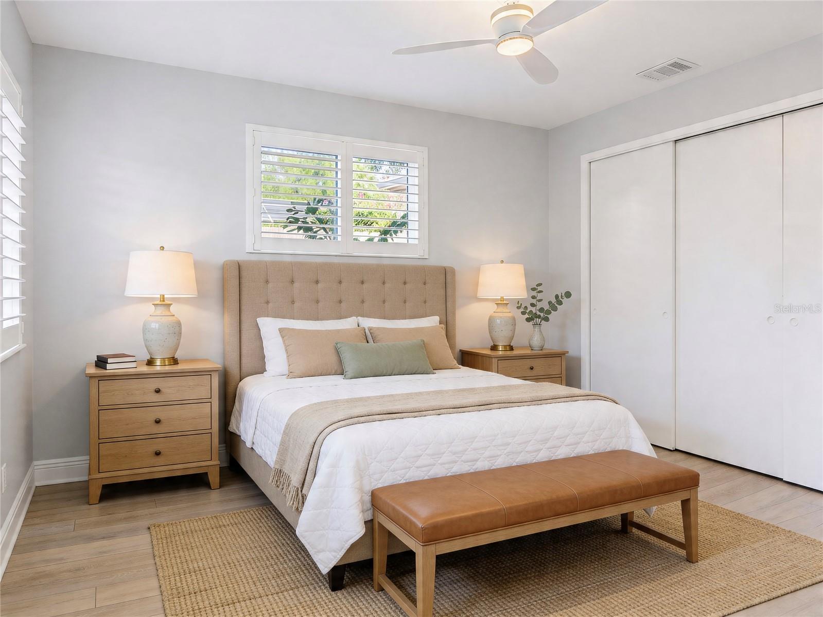 AI Enhanced photo. A spacious master bedroom with plenty of light and and en-suite bath.