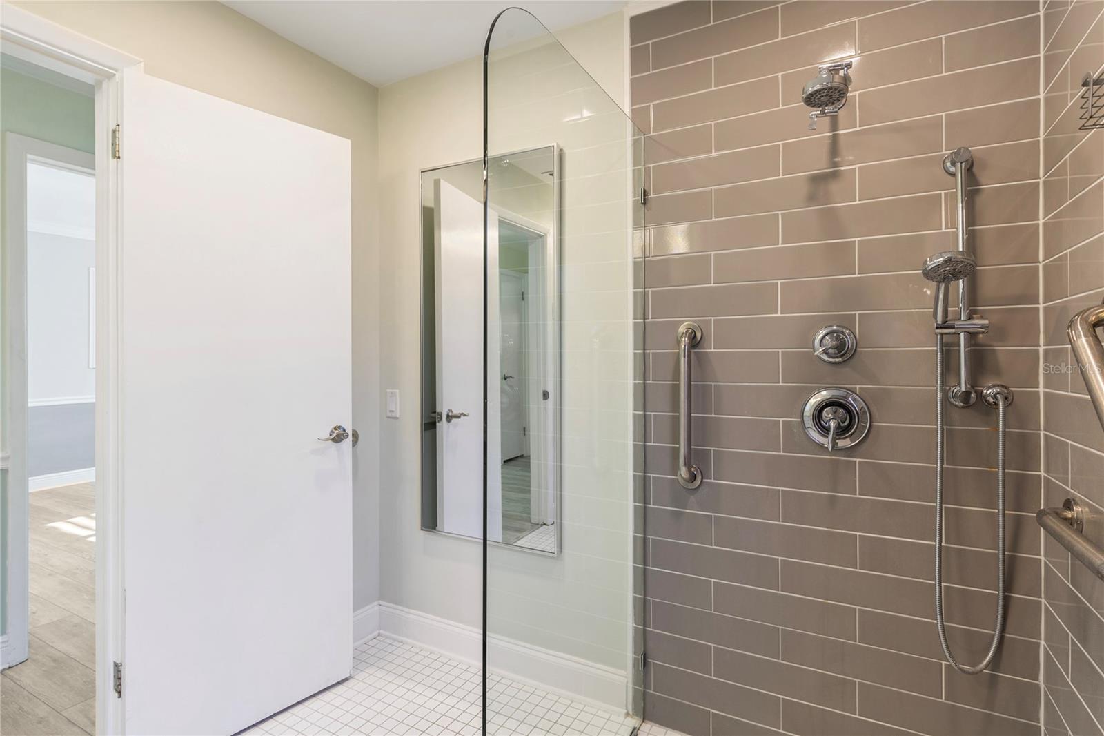 2nd Bath  has new glass partition separating it from teh sink a lav area.