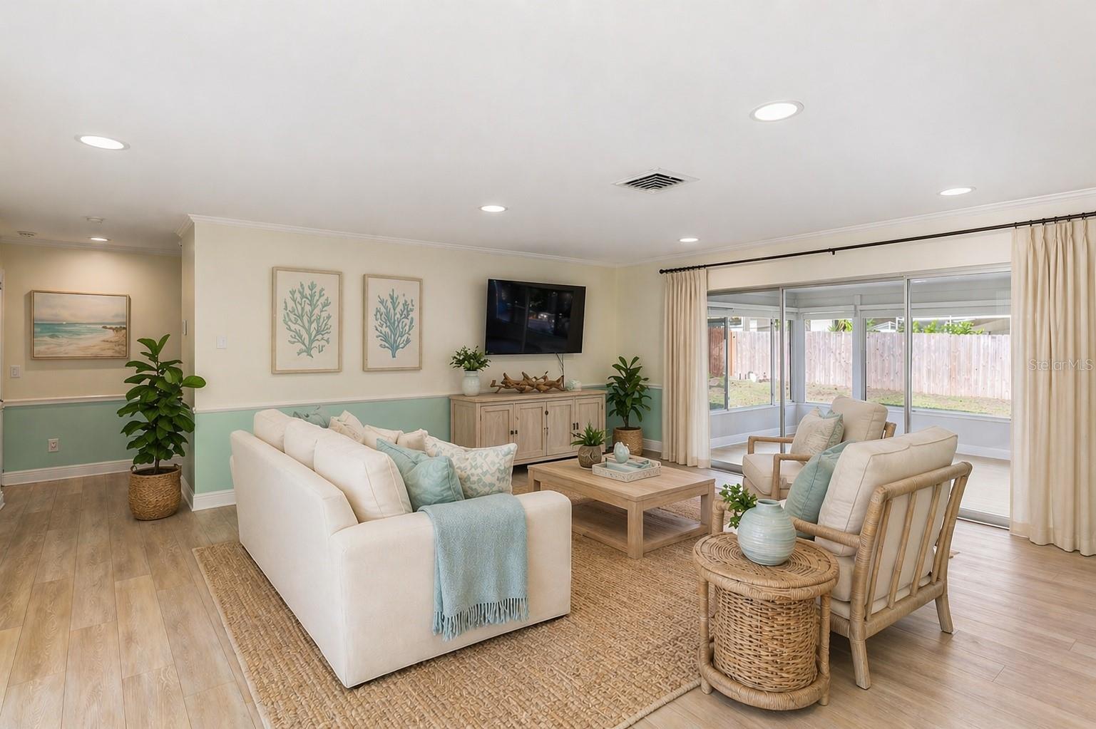 AI enhanced photo... or you can orient your decor around the TV too with the lanai beyond!