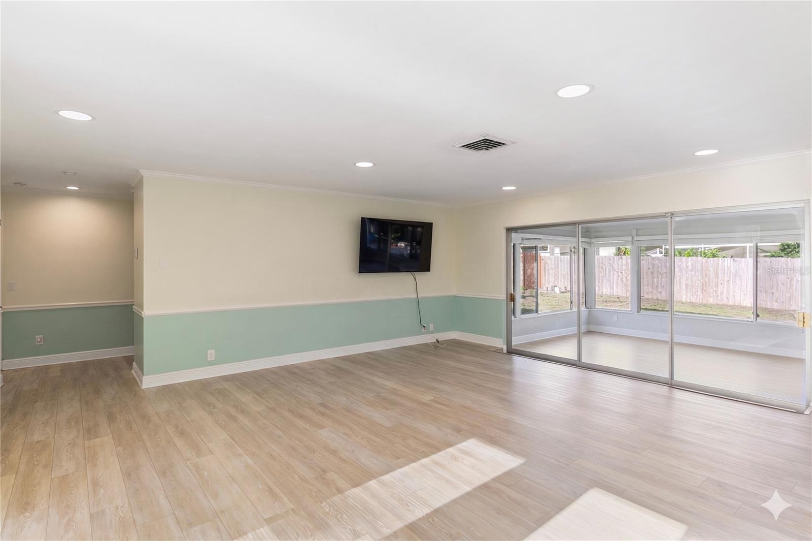 Family Room with the expansive lanai/sunroom beyond!