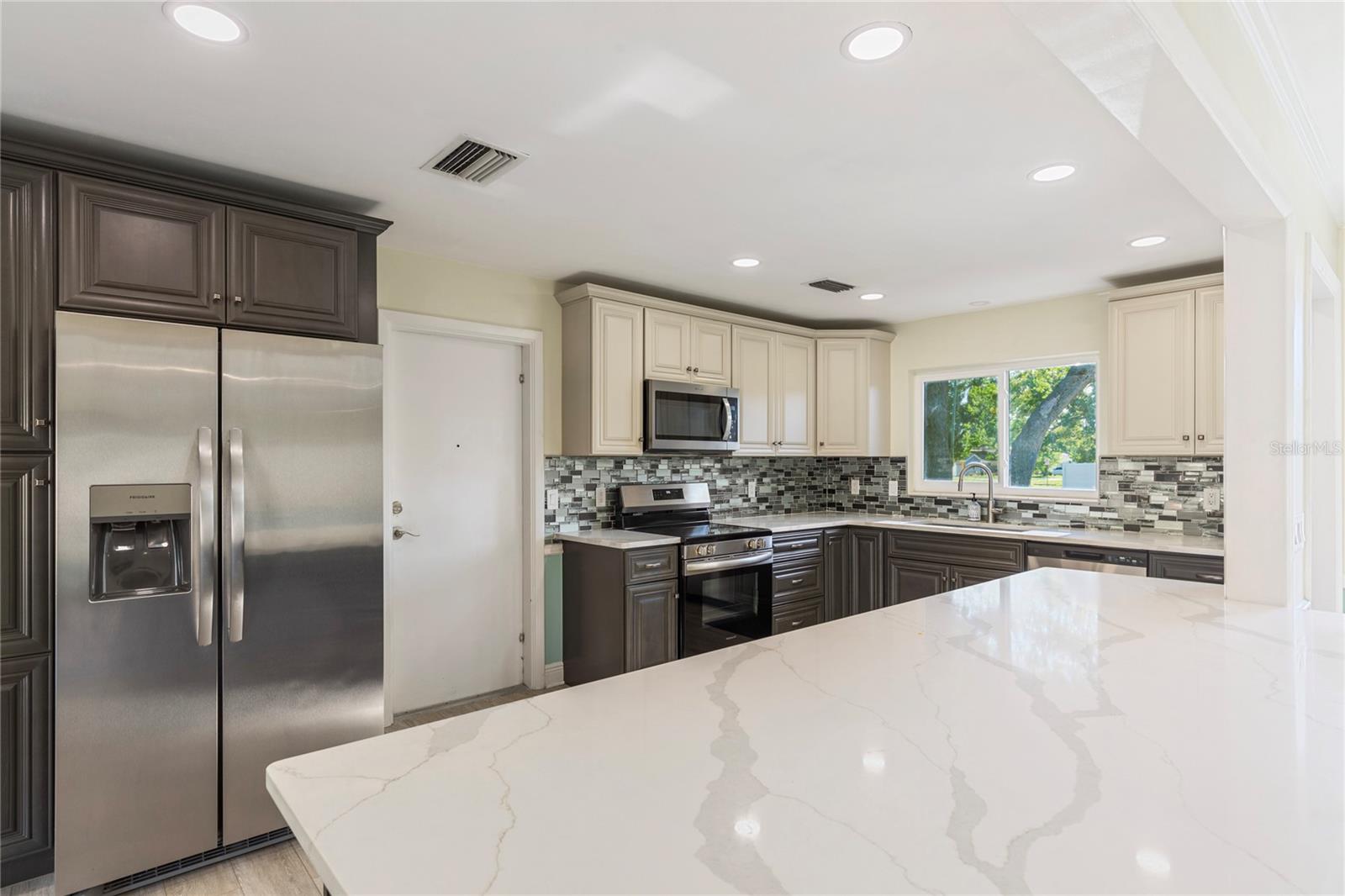 Completely remodeled kitchen in 2024! Lots of storage, new appliances, and quart countertops!