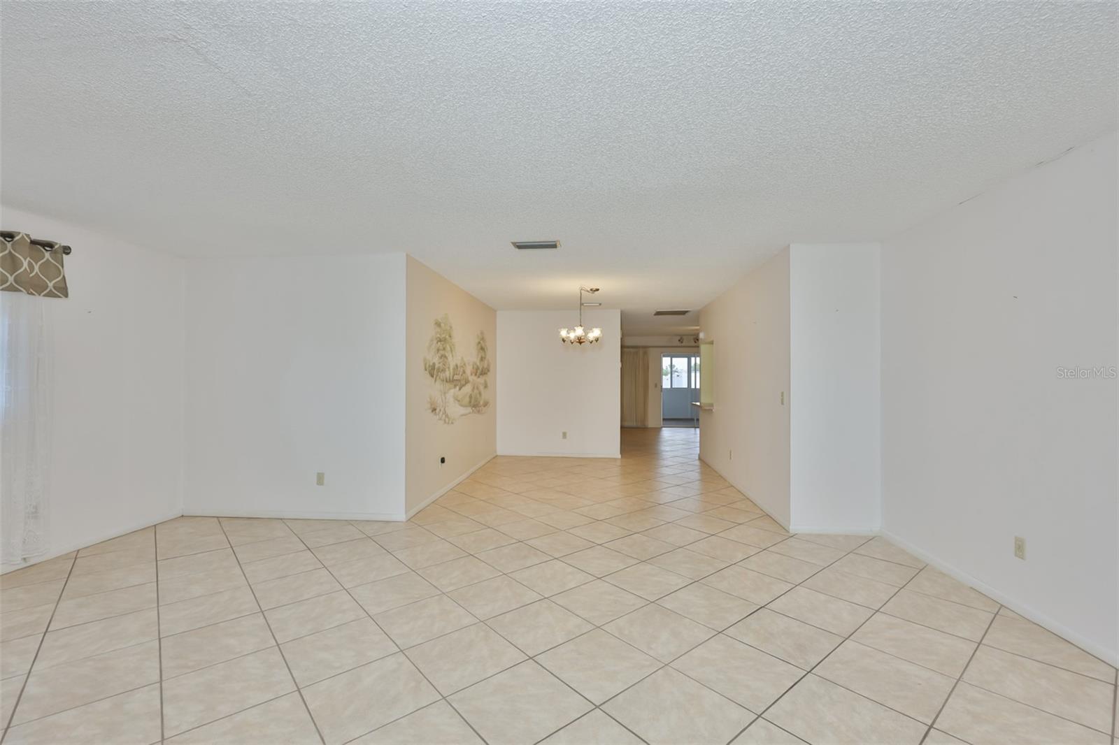 Living room looking to dining area and family room beyond