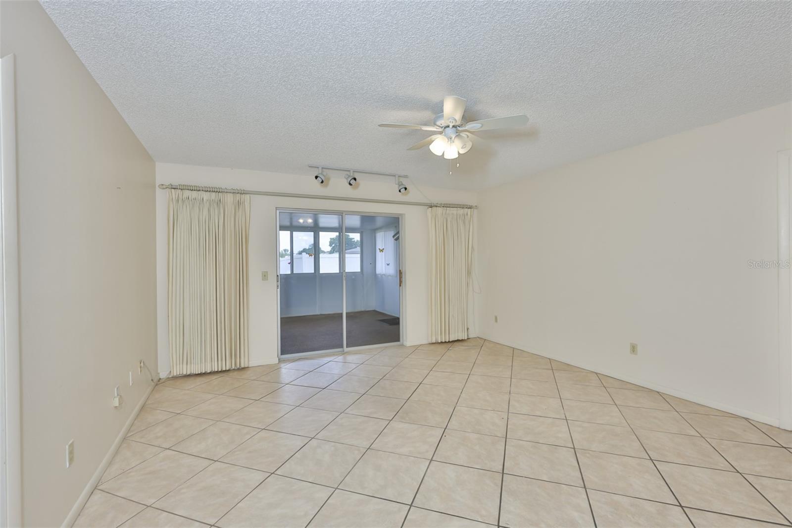 Family room with ceiling fan.