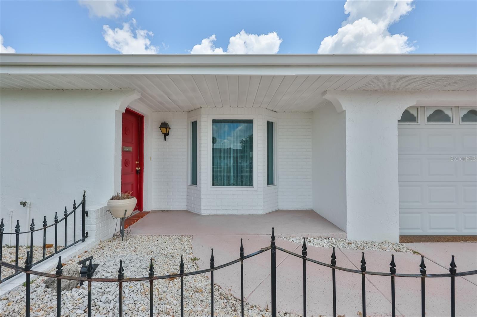 Bay window in front. Covered at front door.