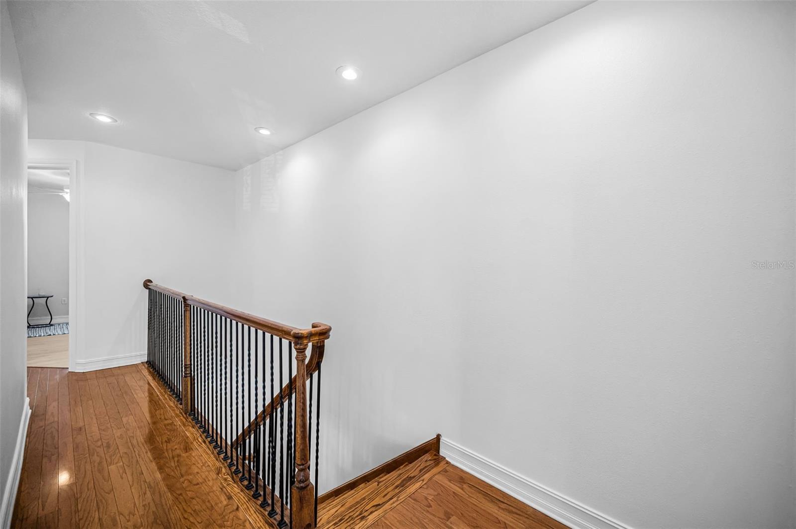 Stunning wood hallway and stairs.