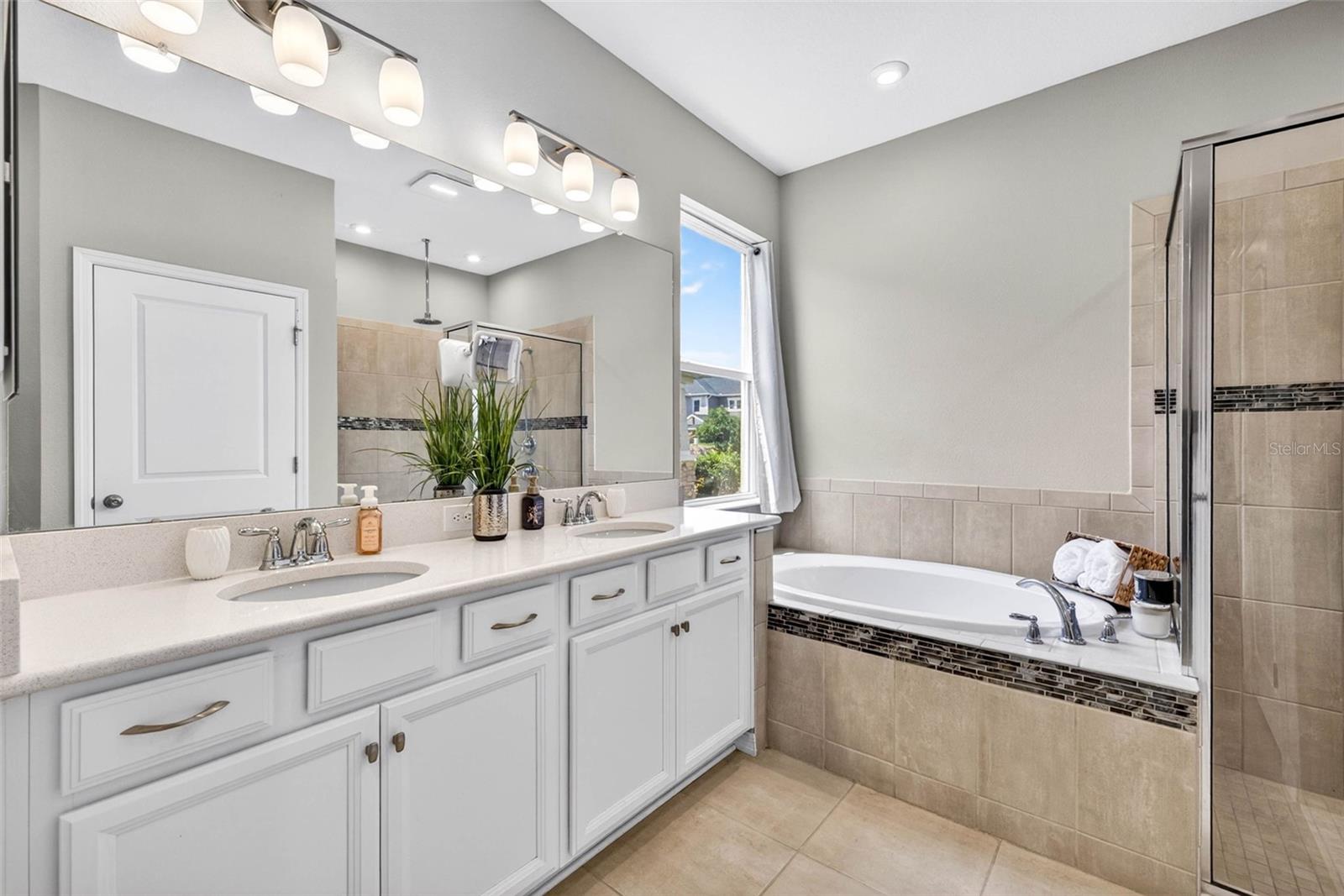 Primary ensuite bath has both tub and shower
