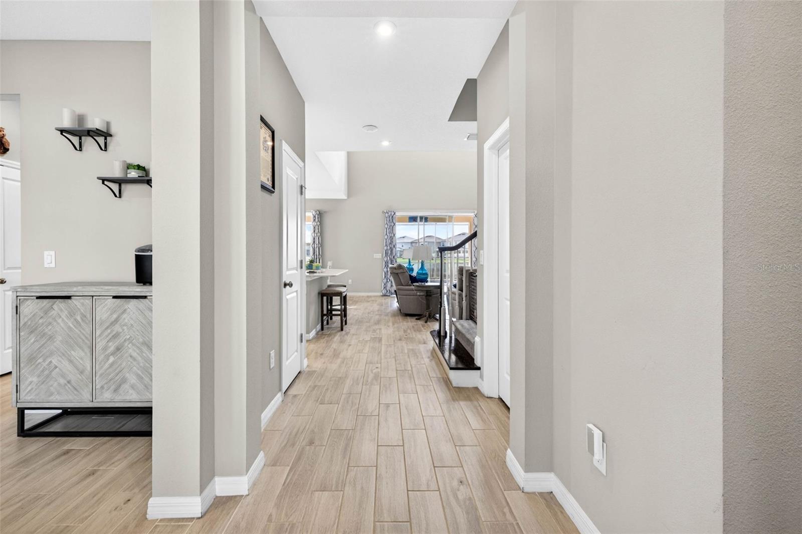 Bright & tall entryway leads to the formal dining room OR make this into a second flex room!
