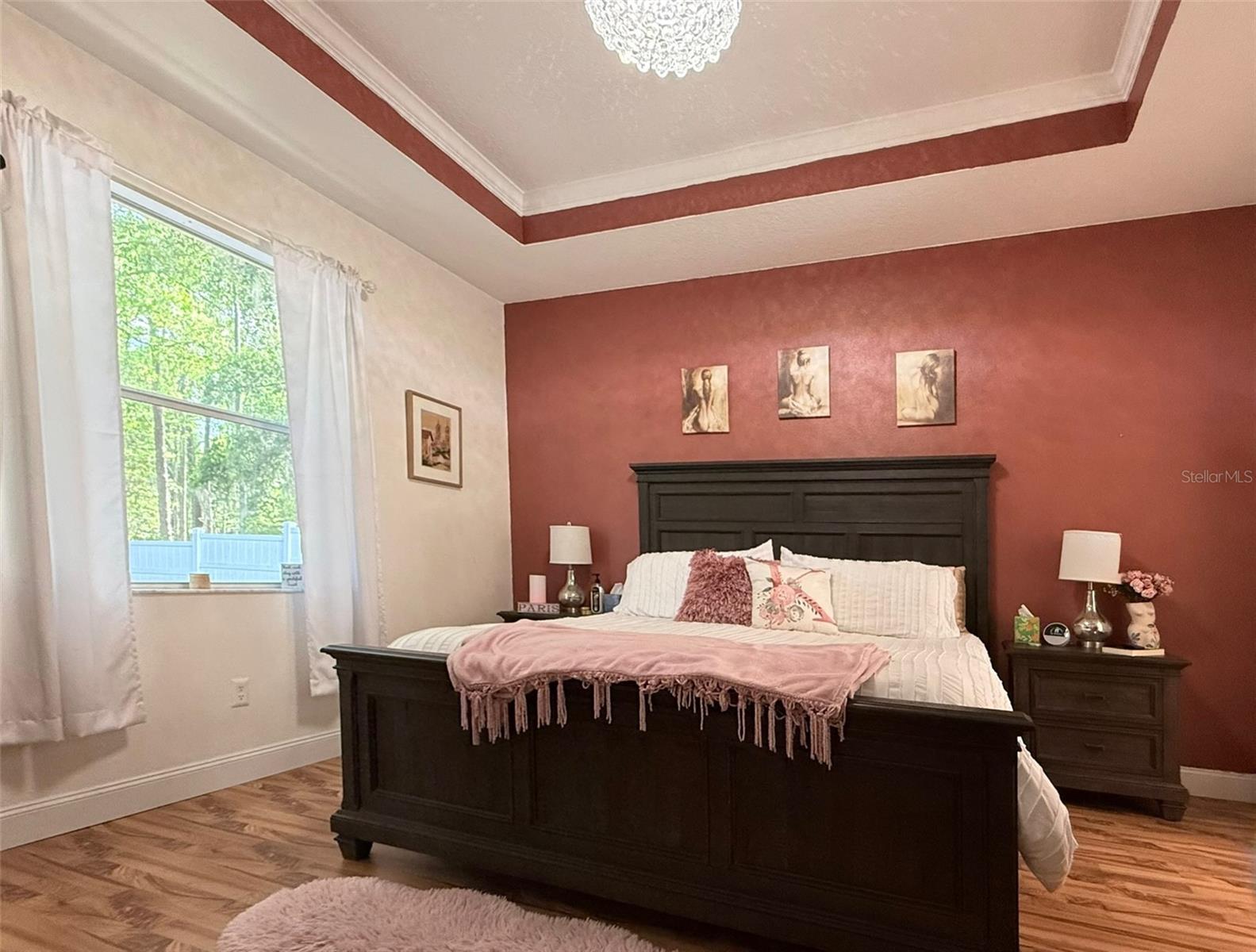 Tray ceilings add a touch of elegance to the space.