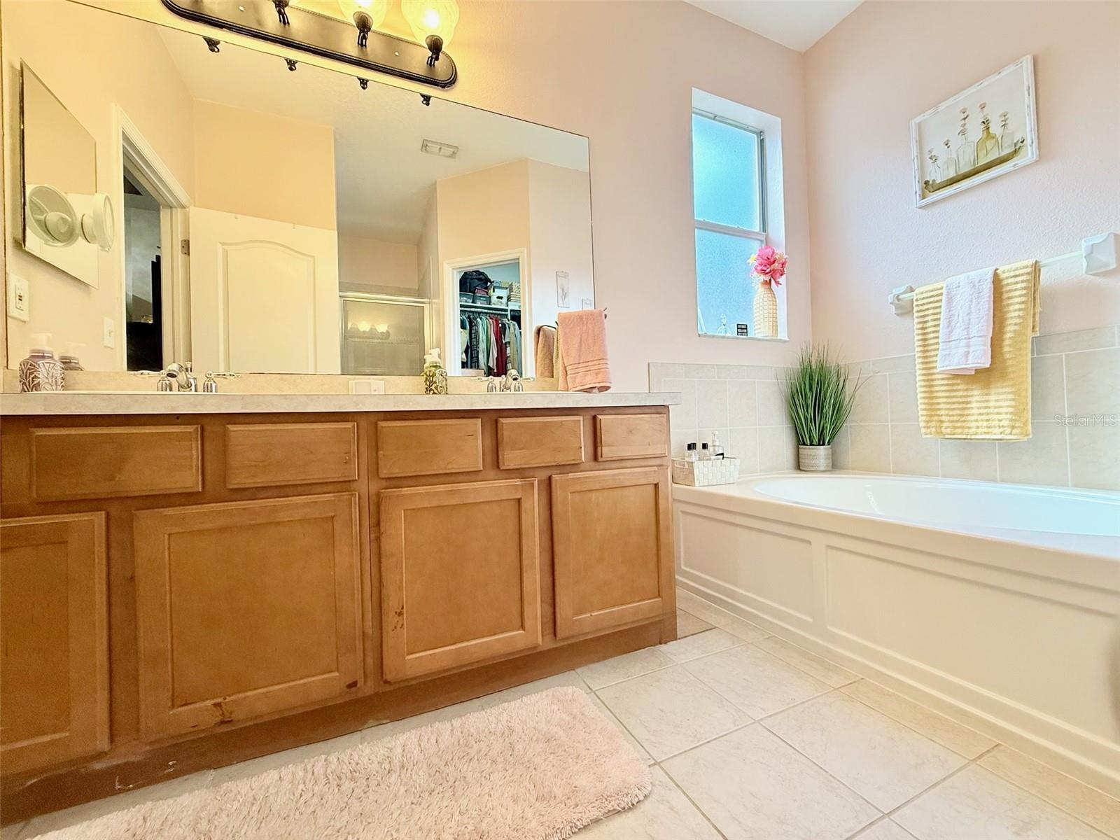 Double Sinks, Soaking Tub, Walk in Shower.