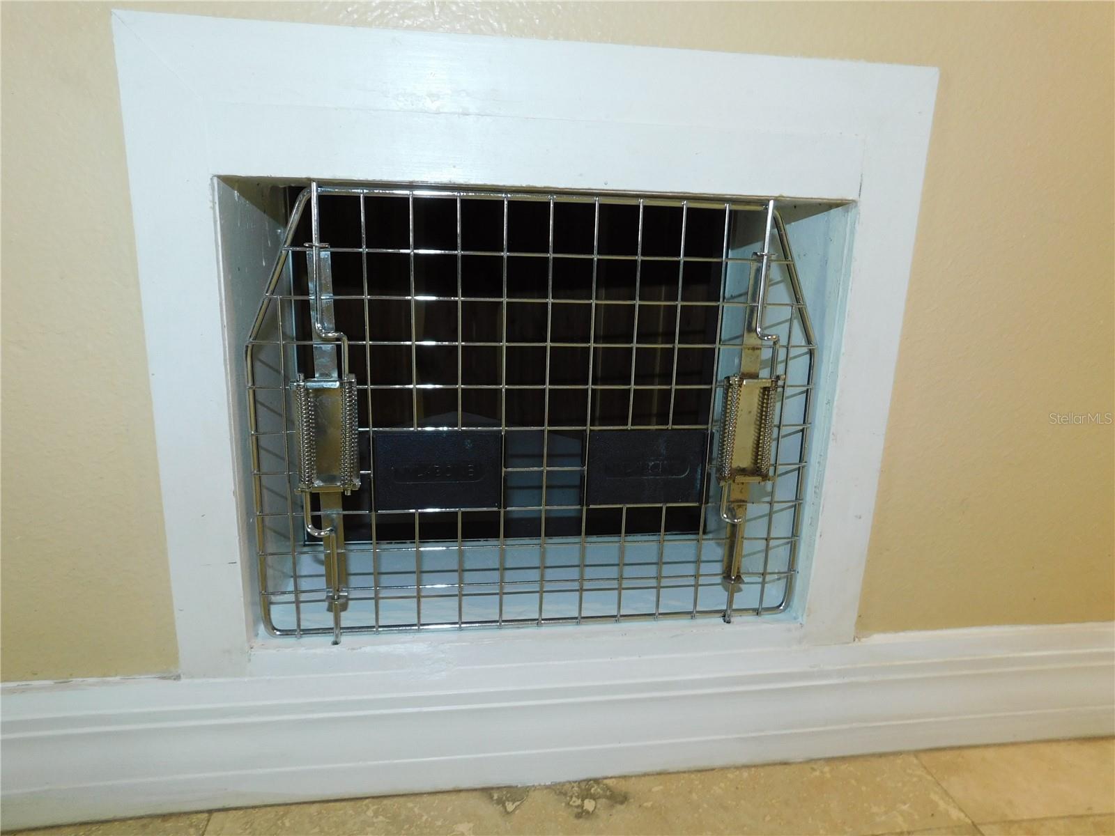 Small dog cubby under the stairs