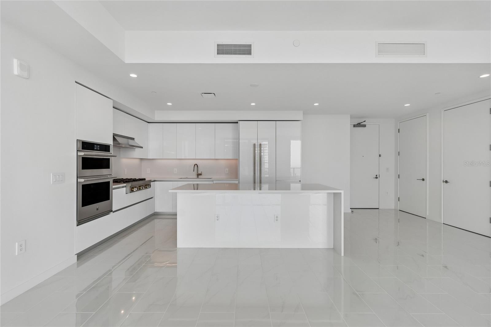 Center Island with waterfall edge quartz countertop