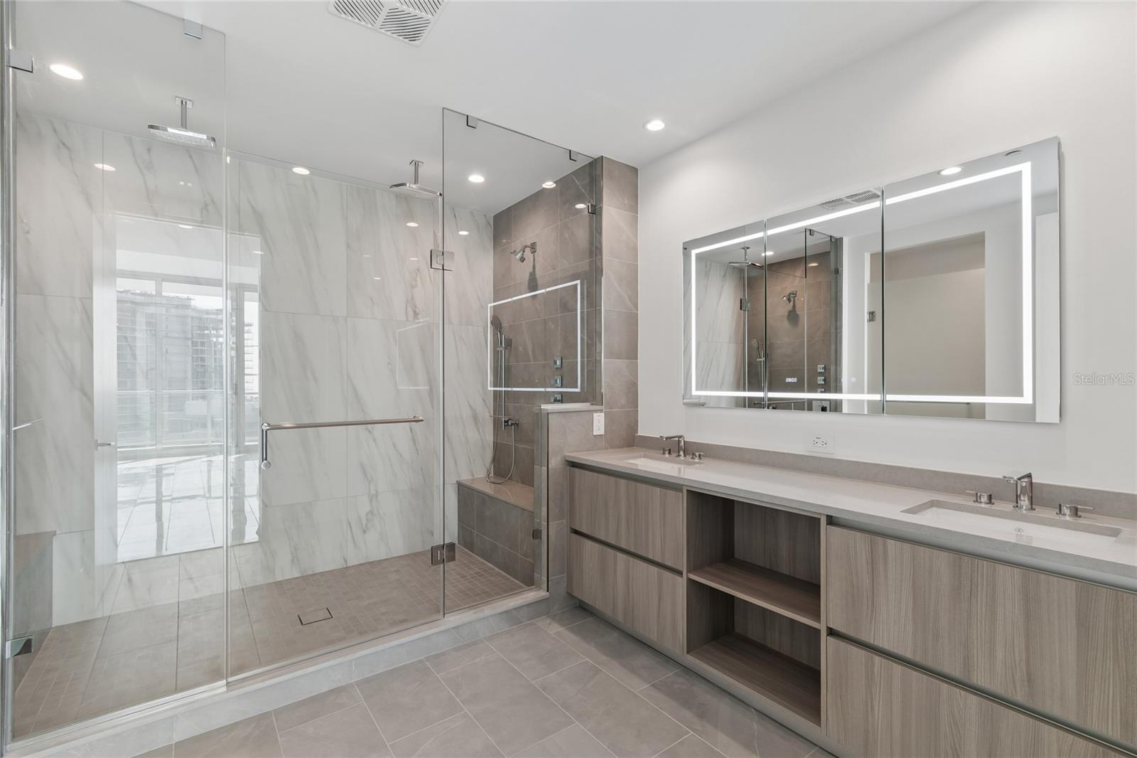 Amazing primary bathroom with upgraded medicine cabinet with touch lighting